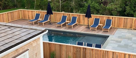 Summer Living! Heated Pool with chaise lounges, outdoor dining and Cabana