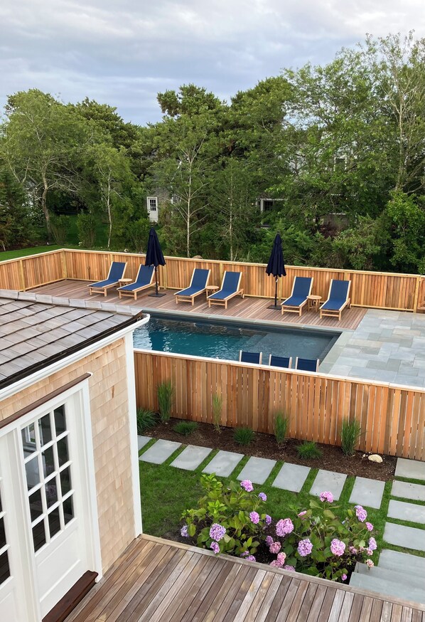 Summer Living! Heated Pool with chaise lounges, outdoor dining and Cabana