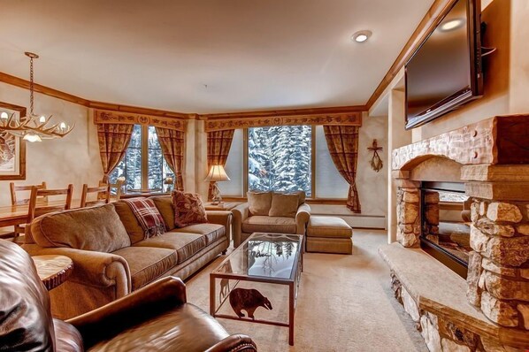 Relax and unwind with a movie or in front of the fireplace in the spacious living area.