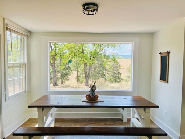 Watch cattle and horses grazing at the large farm table.