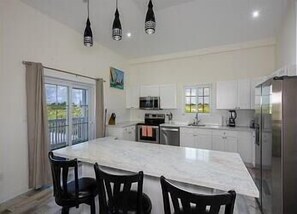 Luxury kitchen finished in quartz and stainless steel.