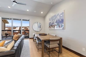 Black Rock Ridge 14536: "Cozy space with dining table, sofa, and access to outdoor patio."