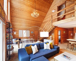 Natural wood surrounds the bespoke furniture which offers both comfort and style