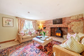 Cosy Cottage, Chebbard, Dorchester: The attractive sitting room with wood burning stove