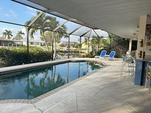 Pool area with sun lounge and outside bar