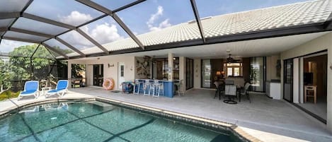 Pool, bar, and outdoor dining