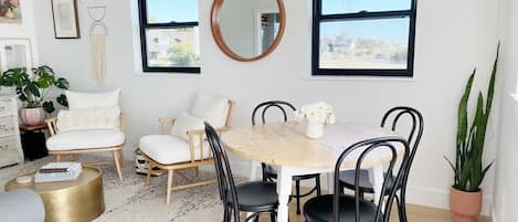 The open space with the dining table next to the living space