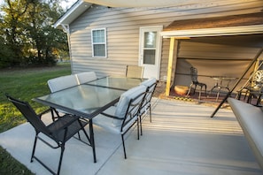 Patio: Fire up the charcoal grill & enjoy the furnished patio, canopy, & lights