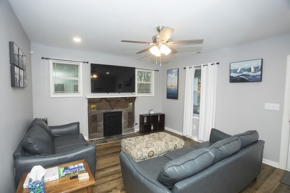 Family room: Spacious layout. 
Put your feet up, enjoy FireTv, and RELAX.