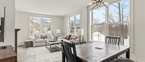 Beautiful views of mountain and sunset from this corner-unit's living room.