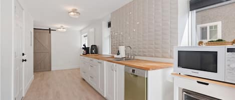 Kitchen area with fridge n airfryer microwave n toaster oven