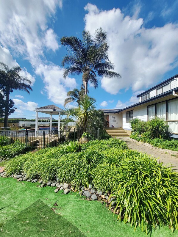 Look over the pool and front of the house from the drive way