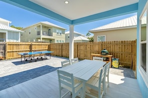 Private Backyard with Hot Tub, ping pong table, cornhole, green egg grill, covered dining, and fire pit.
