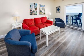 Living Room - Enjoy this colorful & spacious living room with plenty of seats for everyone!