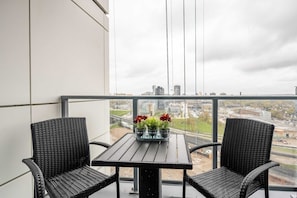 Private Balcony With Seating Perfect For Enjoying Morning Coffee Or Evening Drinks