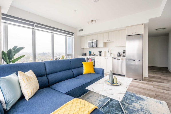 Open Concept Living And Dining Area Featuring A Smart TV And Stunning Views