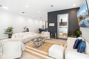 Living area 
75 inches Television
Overlooking to the patio area
Sliding doors