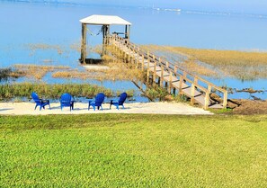 Private boat dock and beach with fire pit area