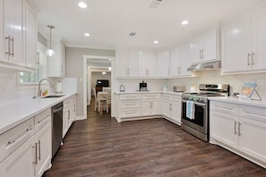 Ton's of cabinets and ample entertaining space!