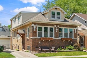 Brick two-unit building.  VRBO unit is on the second floor. 