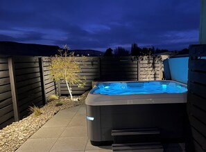 Private hot tub on the back patio seats 8 people.