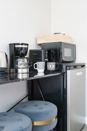 Enjoy a quick bite or a snack in our compact yet functional dining area, complete with a mini-fridge and microwave.