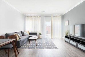 Unwind in our comfortable living room, complete with a pull-out sofa and access to Netflix, Amazon and cable TV channels.