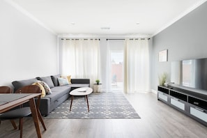 Unwind in our comfortable living room, complete with a pull-out sofa and access to Netflix, Amazon and cable TV channels.