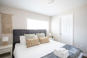 Experience a peaceful night's sleep in our serene and tranquil bedroom.