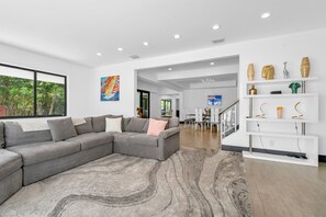 On the ground floor, you'll find a comfortable sectional couch perfect for stretching out, which also converts into a foldable mattress to accommodate 2 extra guests.