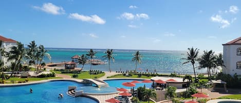 Beautiful view of main pool and ocean from patio