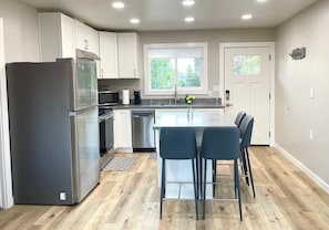 The kitchen is fully-equipped with all the cooking and dining essentials you'll need.
