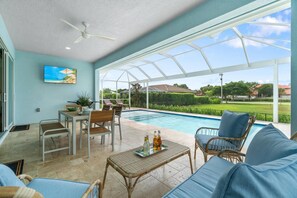 Enjoy Florida outdoor living rain or shine with the large covered lanai.
