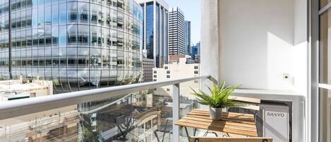 A balcony with city views & a setting.