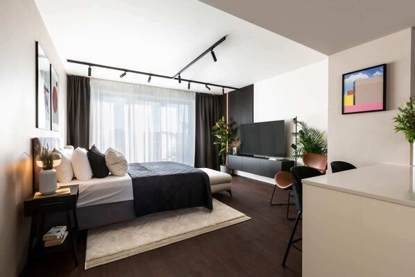 The first bedroom connected to living room and kitchen