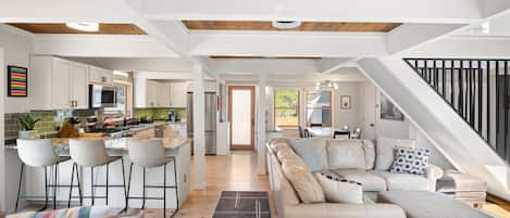 Your open-concept living/dining/kitchen area.