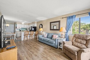 The ocean front living room is well-appointed with comfortable furnishings.