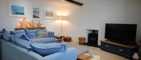 The lounge has a wood burning stove for cosy nights in