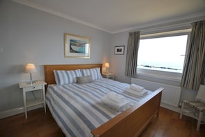 Enjoy sea views from the large king bedroom