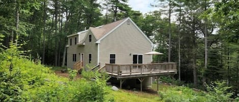 South and back side of house with large deck off the Great Room.