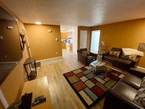 Living Room With 60" Flat Screen TV