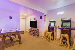 Adjacent to the bunk room is this newly upgraded epic game room that is home to arcades, air hockey, a Roku TV, board games and books, foosball, darts and lots more!