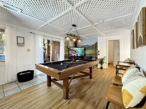 Billiards Room: Unwind in style with a pool table, sleek decor, and stunning mountain views!