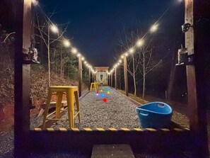 Outdoor Bocce Ball Court: Illuminate your evenings with glow in the dark bocce ball!