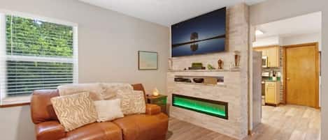 Living room 65 inch Smart Tv . 
Custom built Fireplace 9 different color flames
