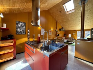 Kitchen opening onto living room