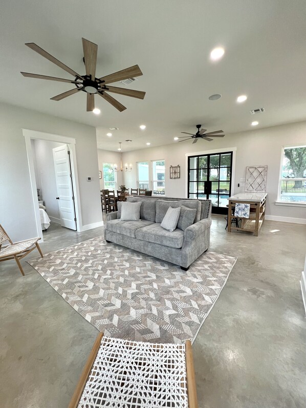 Open concept living area. New, custom sleeper sofa bed. (Queen)