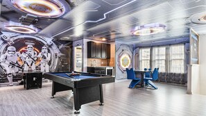 Star Wars-themed game room with pool table and arcade fun!