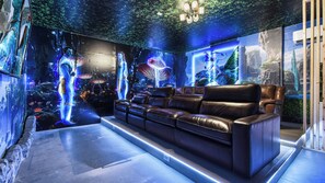 Immersive Avatar-themed theater with cozy recliners and vibrant decor!