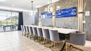 Luxurious dining area with stunning accents and poolside views!